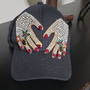 Embellished Black Cap with Gold and Red Accents